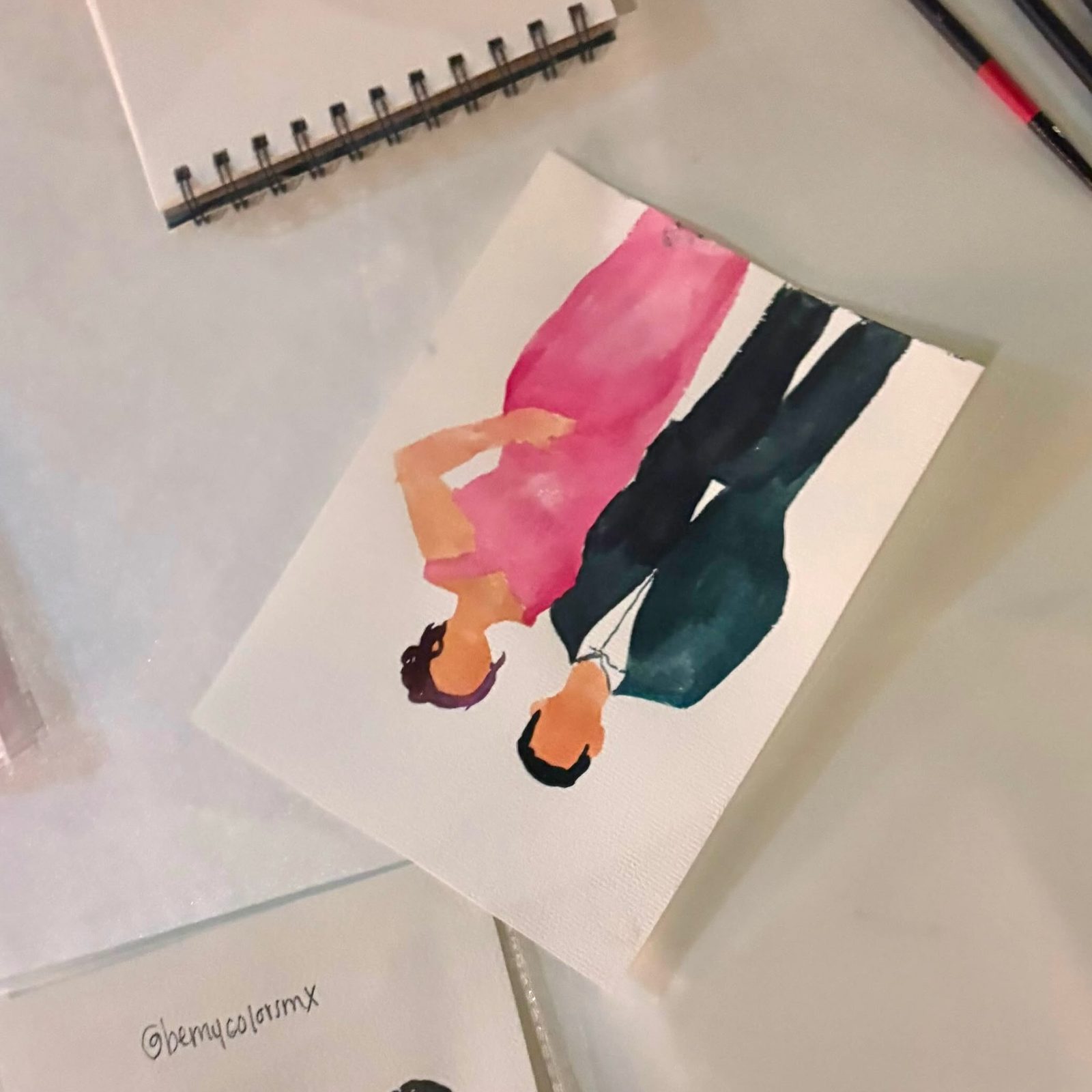 Retrato en acuarela de una pareja pintado durante un evento